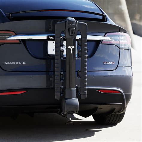 When using the tow package to carry accessories, the 2" x 2" (5 cm x 5 cm) square hitch receiver is designed to support vertical loads of up to 160 lbs. . Tesla tow hitch accessories